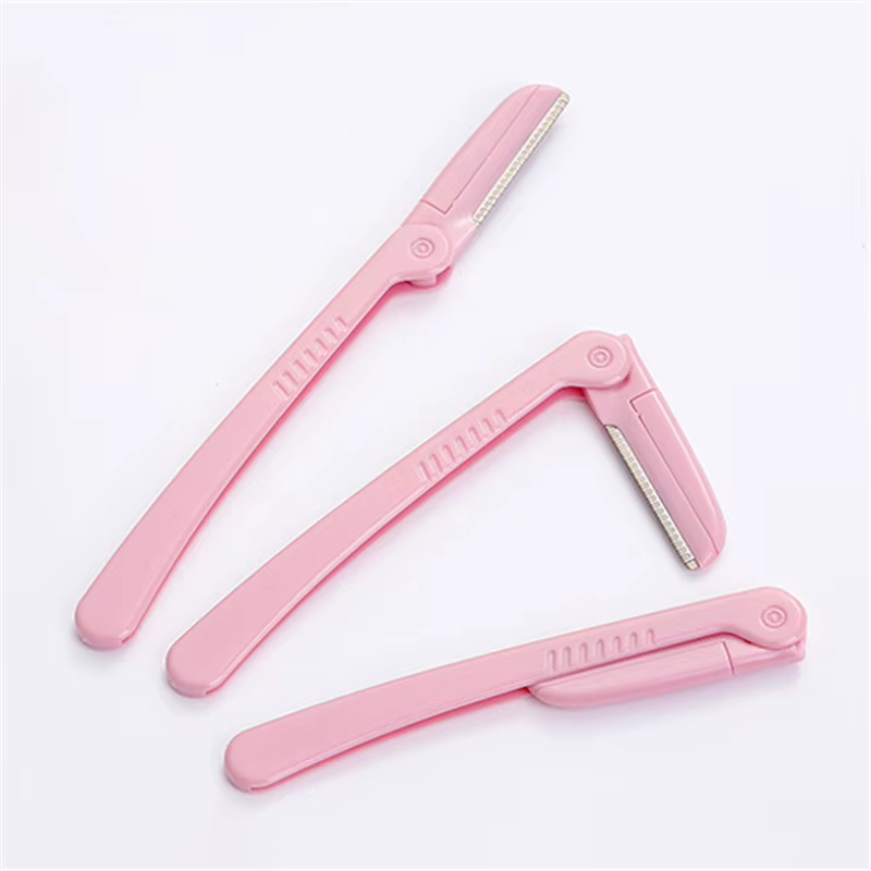 Tondeuse à sourcils pliante rose